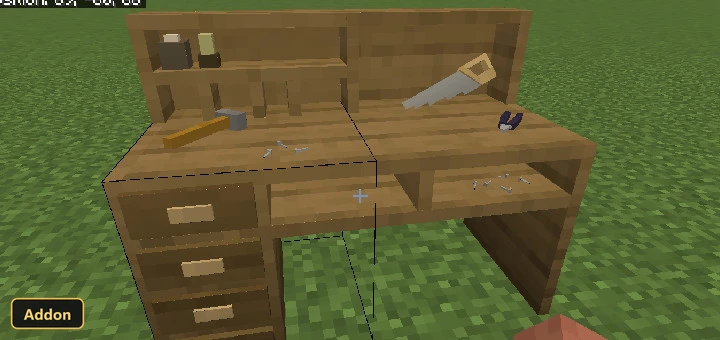 wooden crafting desk with tools on a grass block