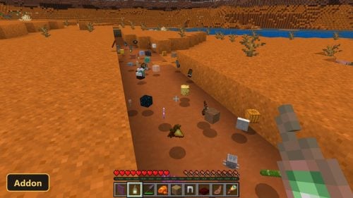 desert biome with various items scattered on the ground