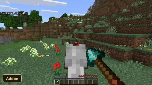 Player on horseback, holding an axe, in a flowery grassy field