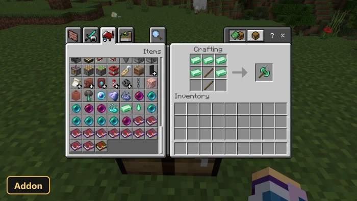crafting recipe for a new pickaxe using emerald ingots and sticks