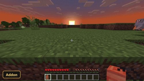 player holding a sleeping bag at sunset