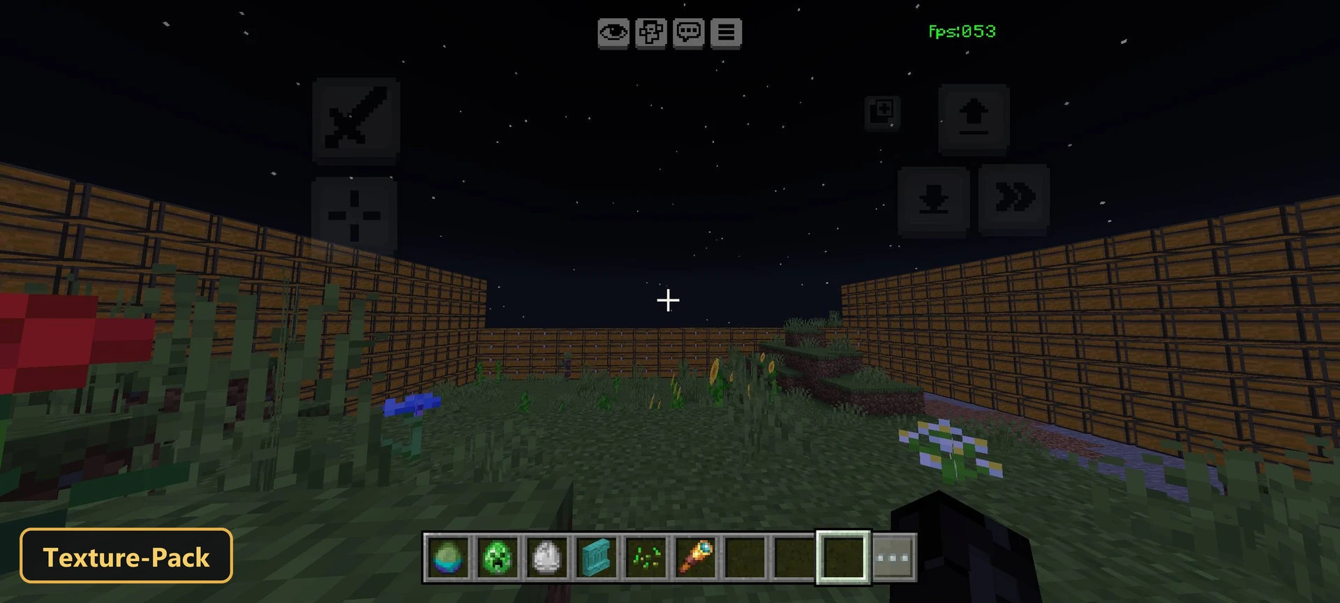 night grass field enclosed by wooden plank walls with flowers