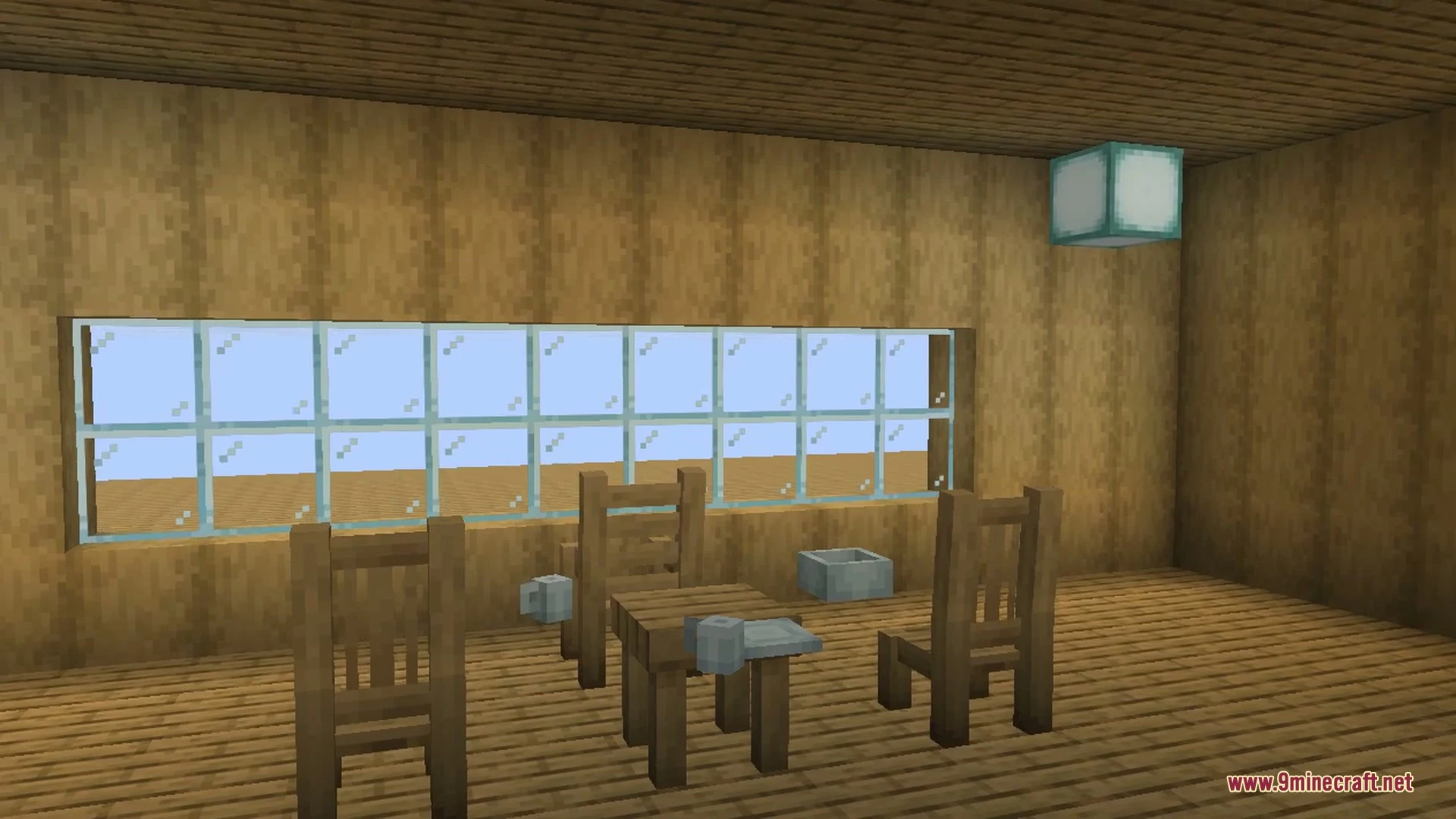 Wooden tables with decorative patterned cloths and a cake near a stove