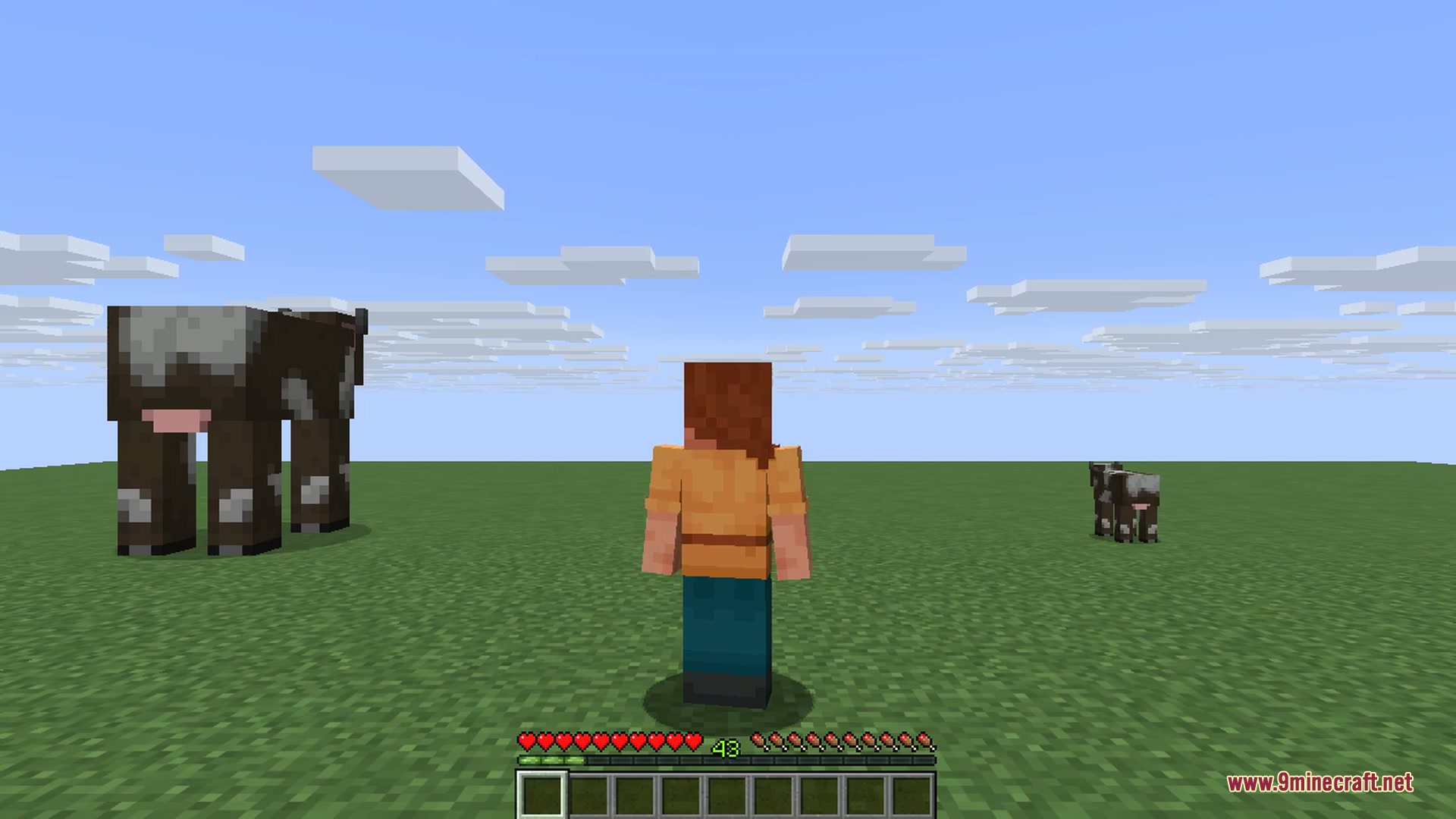 A pig scaled to several times its normal size towers over the arena